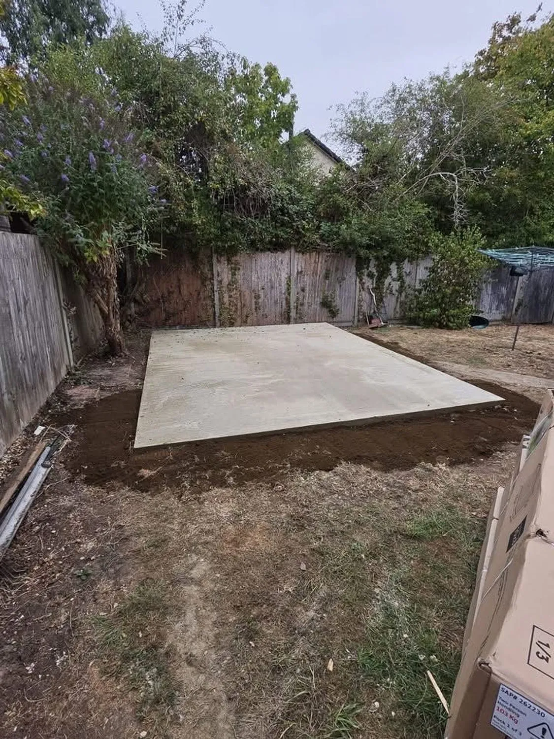 Concrete base poured, floated and left to cure in a rear garden
