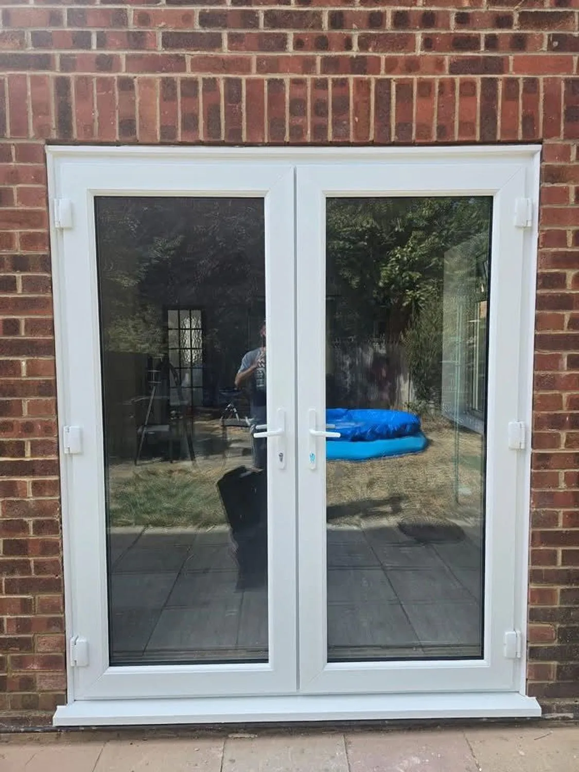 New French doors and finished brickwork seen from the garden