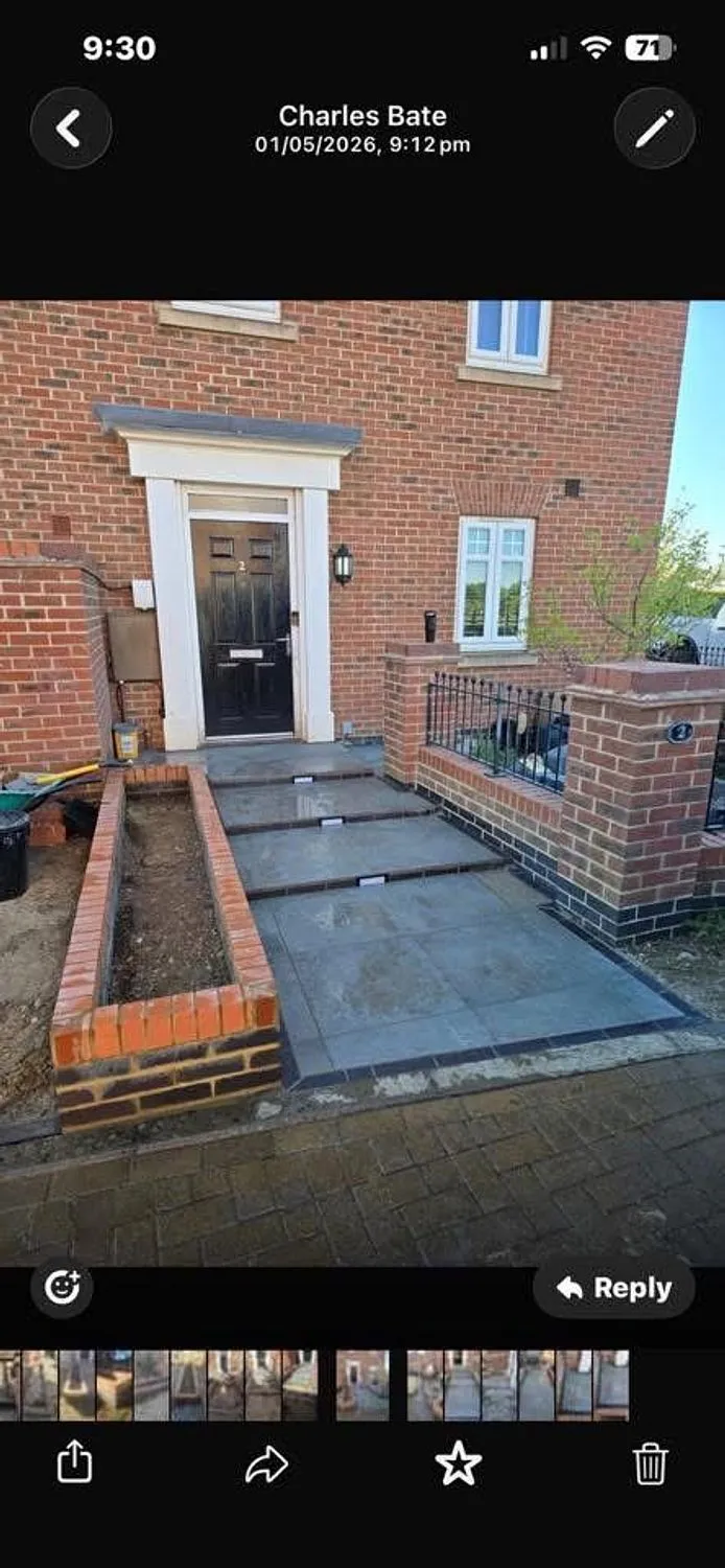 Brick retaining wall and paved front approach with new steps