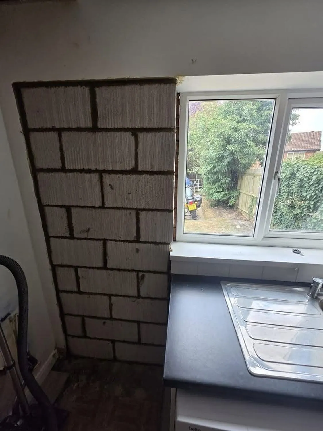 New kitchen window opening with fresh blockwork inside