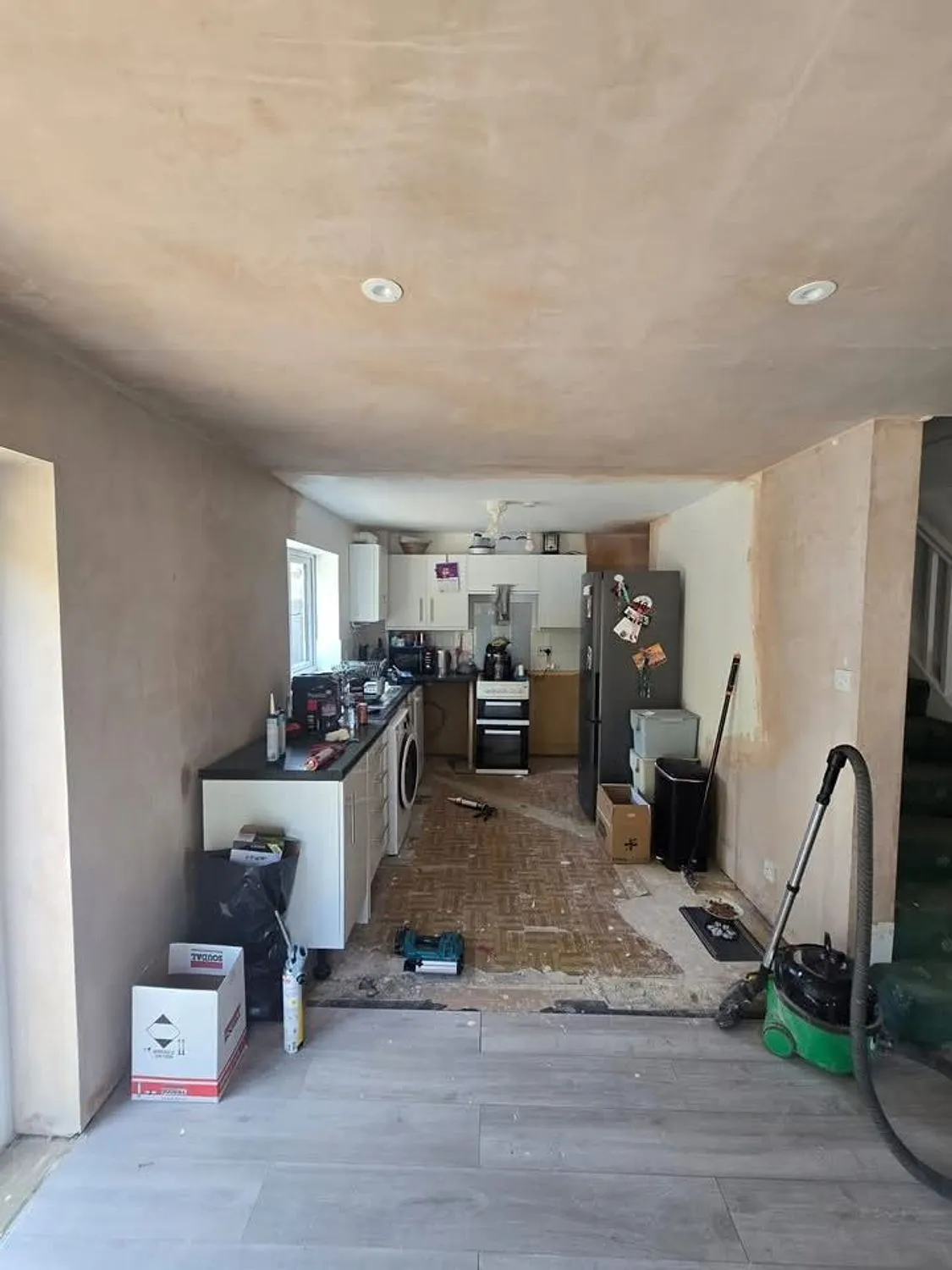 Kitchen area during renovation with new ceiling and plaster complete