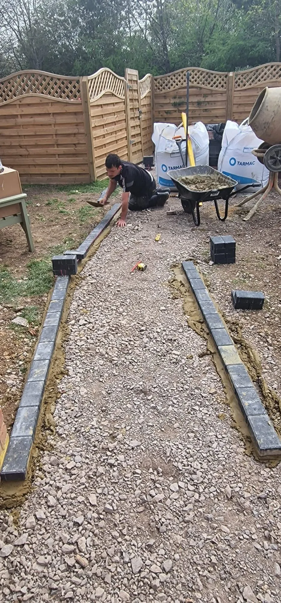 Kerb edging bedded and lined out ready for a new path