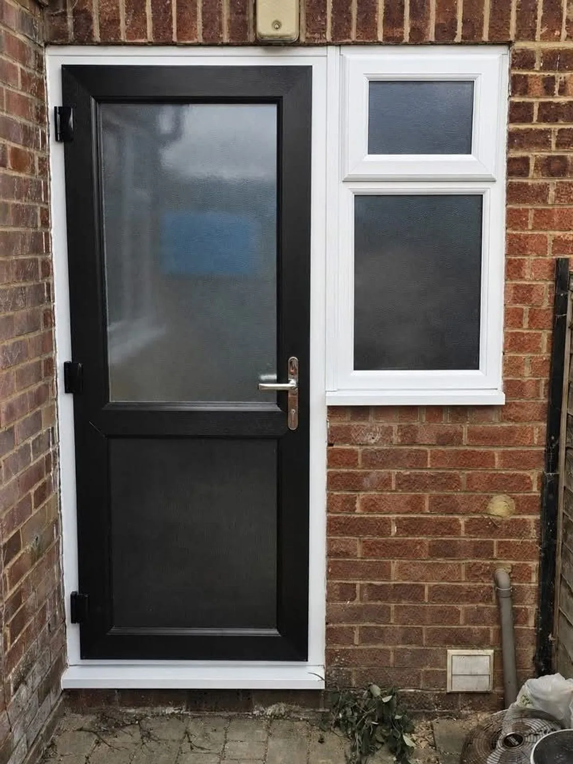 New composite rear door and side window fitted into the same opening