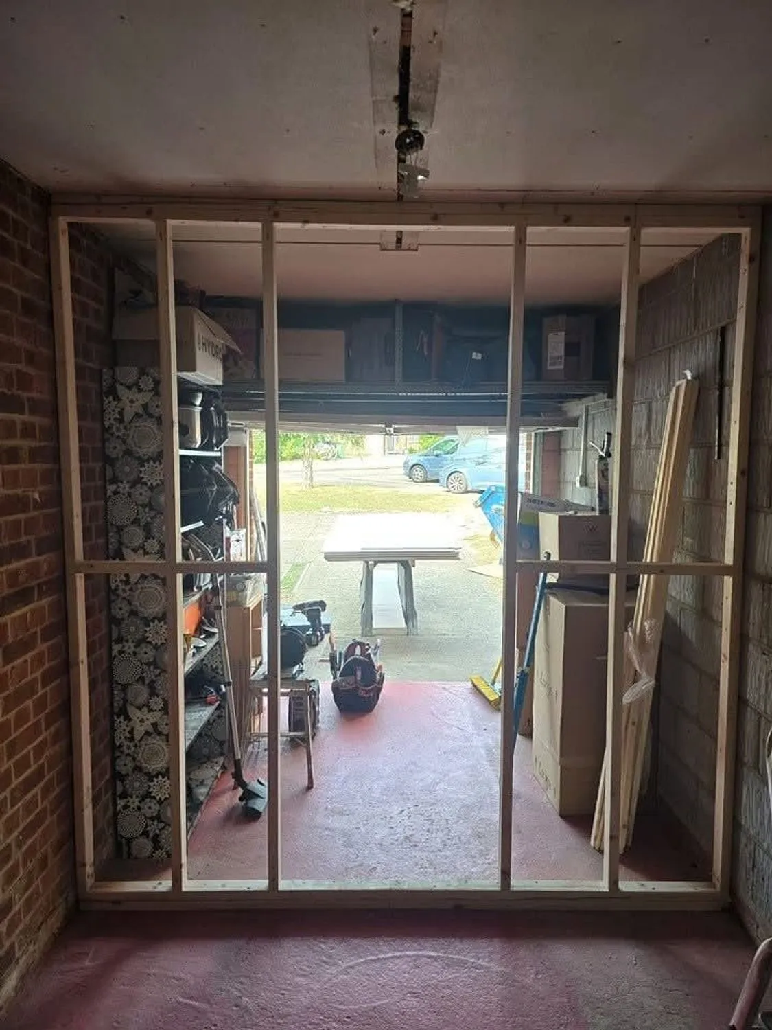 Large structural opening formed between a garage and a living space