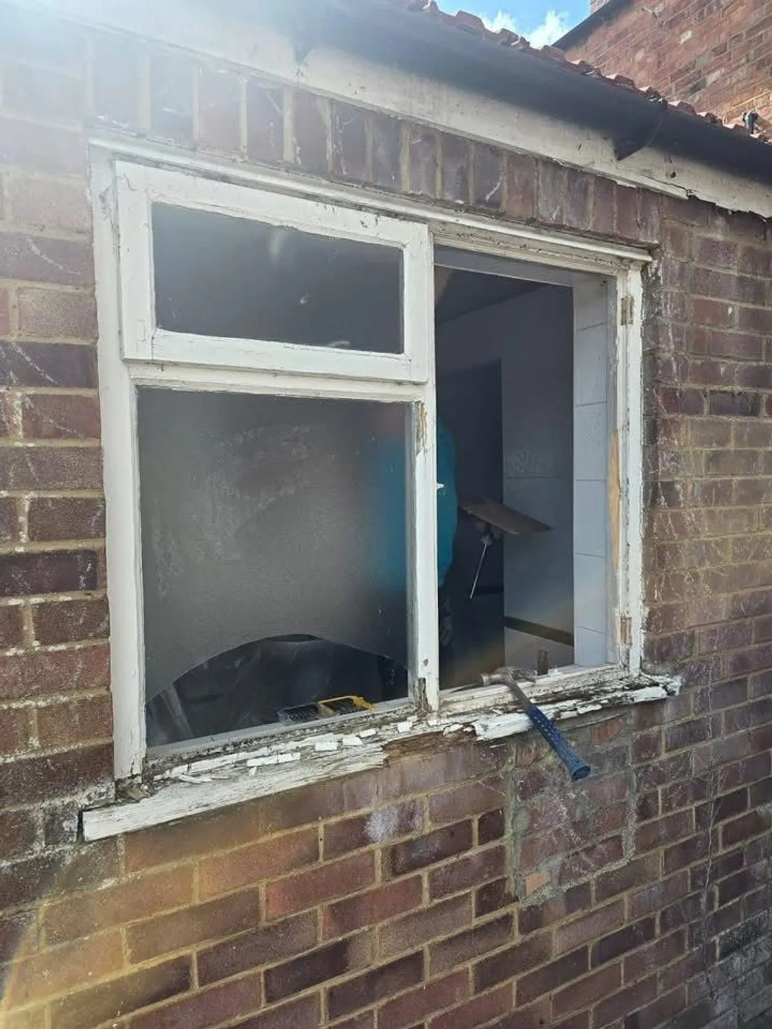 Window opening cut and prepared in a brick wall ready for a new frame